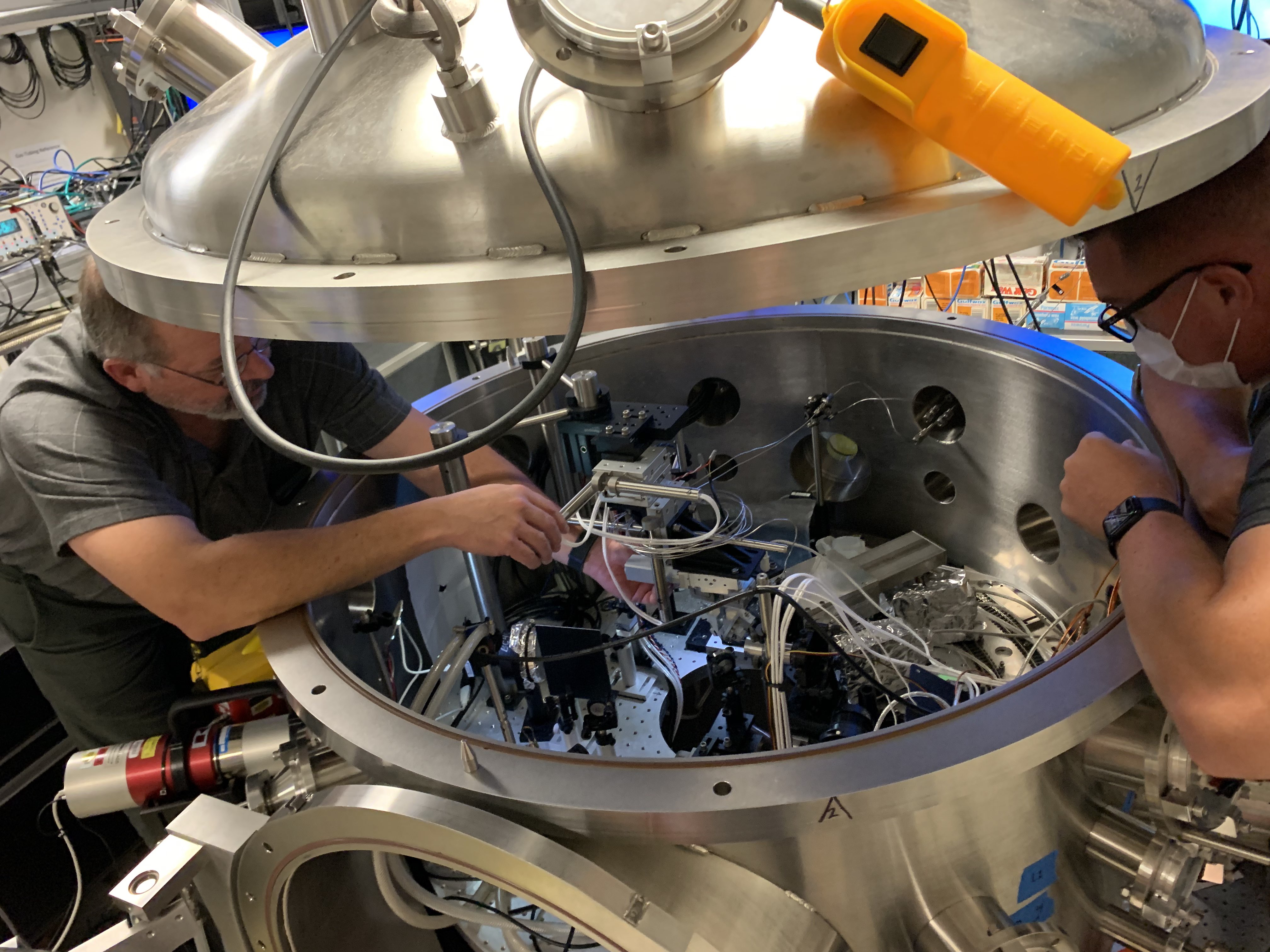 Fig. 1: Physicists setting up a laser experiment